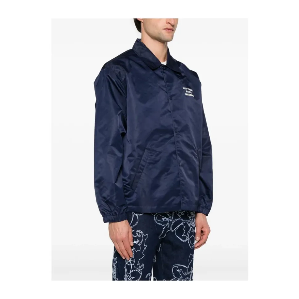 Blå vandafvisende vest med trykknaplukning