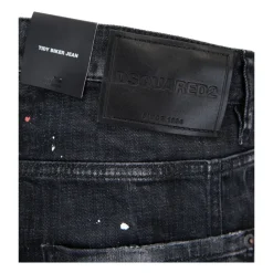 Jeans med knapper og læderpatch