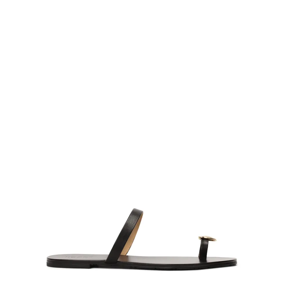 Minimalistiske sorte mules på en flad sål