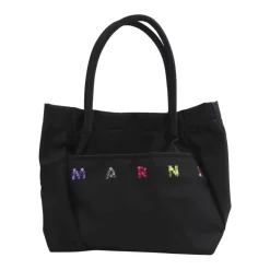 Stilfuld håndtaske med frontlomme